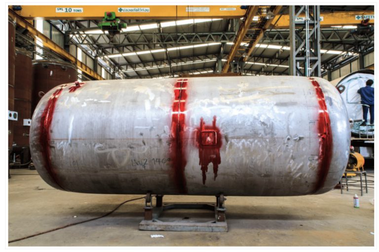 Penetrant testing PT — colour penetrant applied to the surface of a welded joint